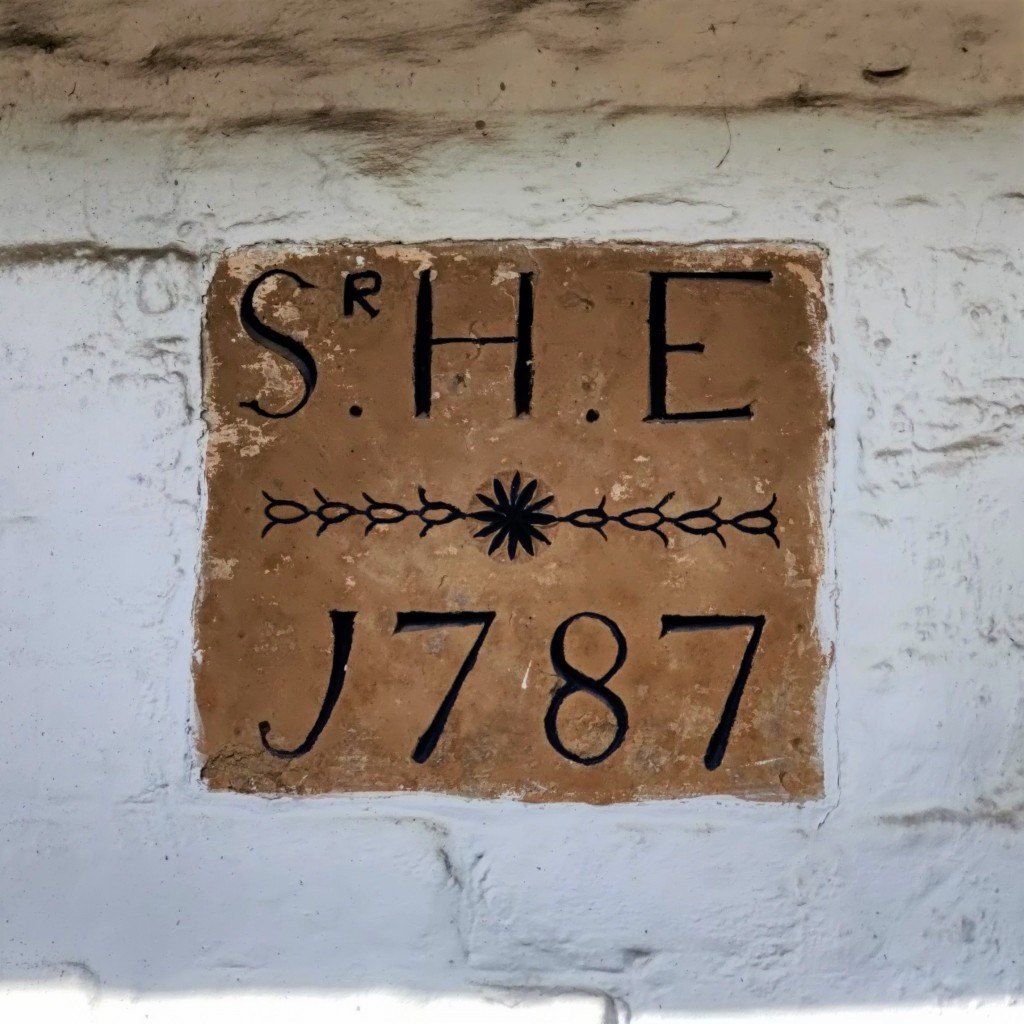 Plaque from 1787 on Honeysuckle and Moss cottages